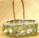 Straw easter basket supply dealer distributes holiday baskets in oval shape with seashell decor and dried grass